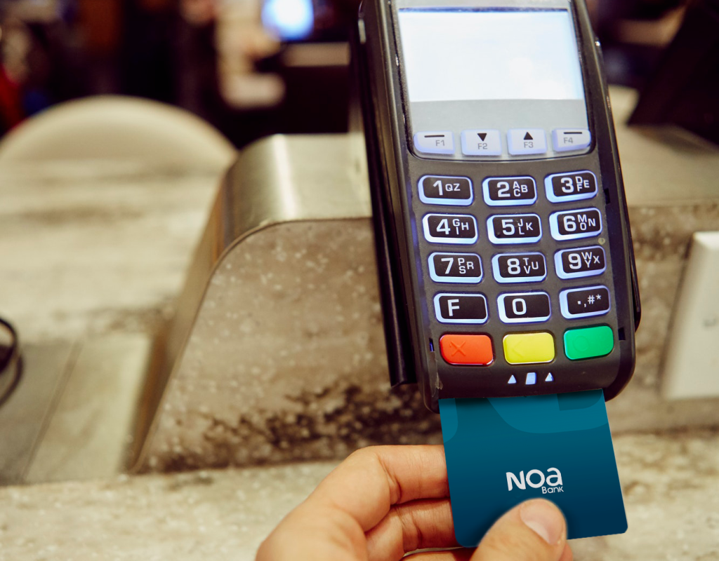 womans-hand-using-credit-card-machine-for-restaurant-payment-noa-bank